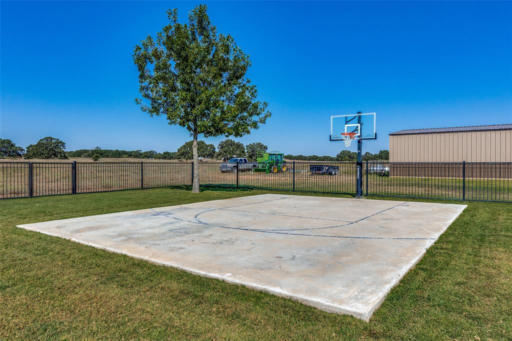 1150 Lone Star Road Bowie, TX 76230 - Photo 9 of 38 a view of a yard with a trampoline