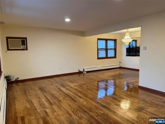 wooden floor in a hall with a window