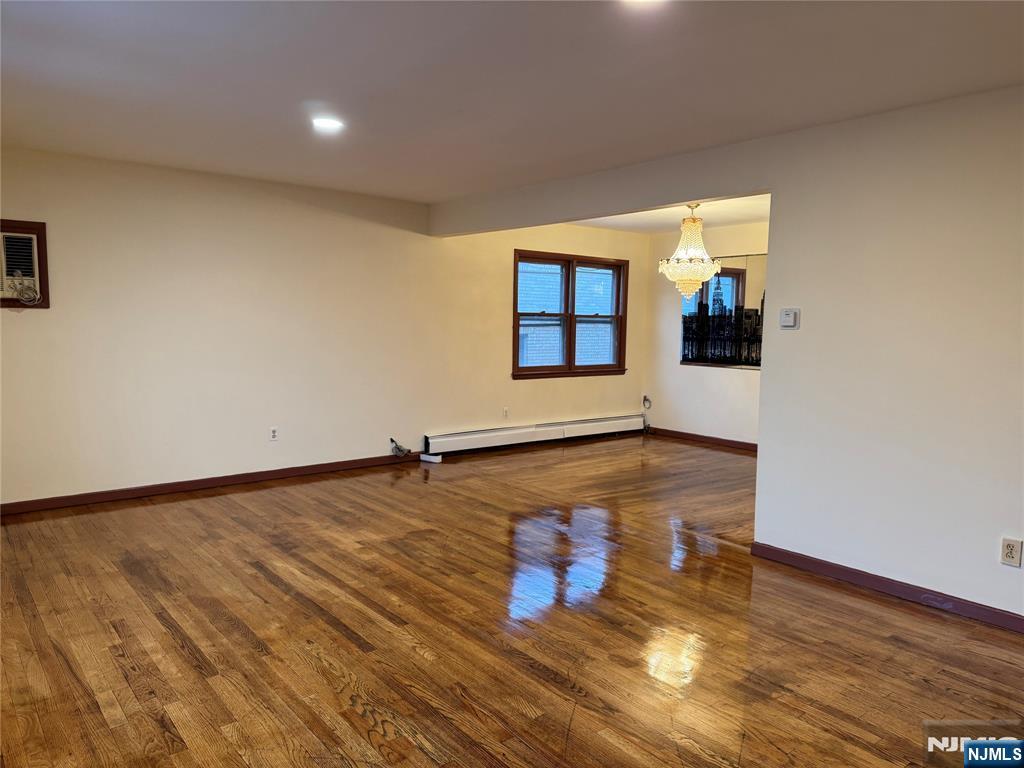 4 Chestnut Street Rutherford, NJ 07070 - Photo 7 of 29 an empty room with wooden floor and windows