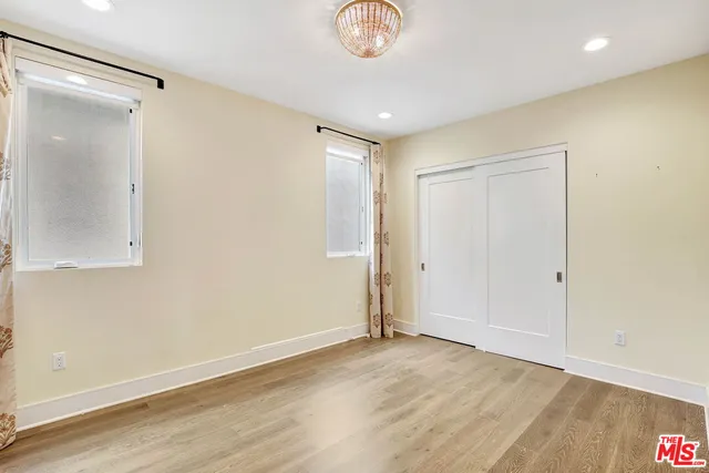 a bathroom with a sink toilet vanity and shower