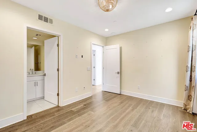 a view of washer and dryer with kitchen in the background