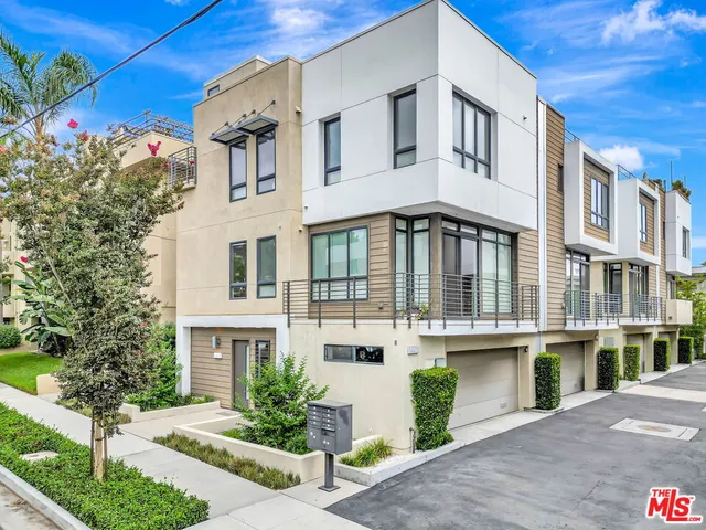 an aerial view of residential building with parking space