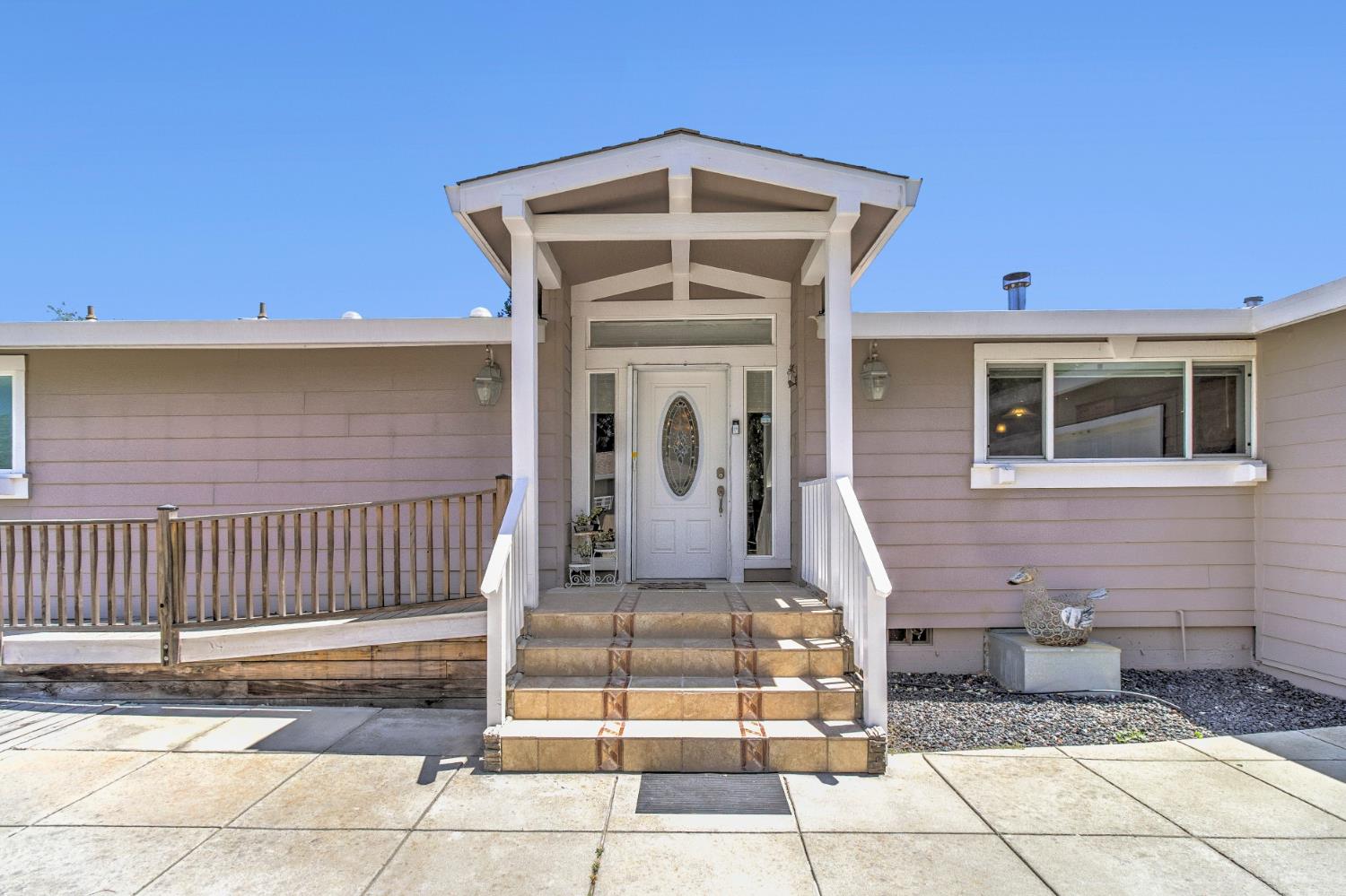 12390 Hobday Road Wilton, CA 95693 - Photo 3 of 92 a front view of a house with a rug