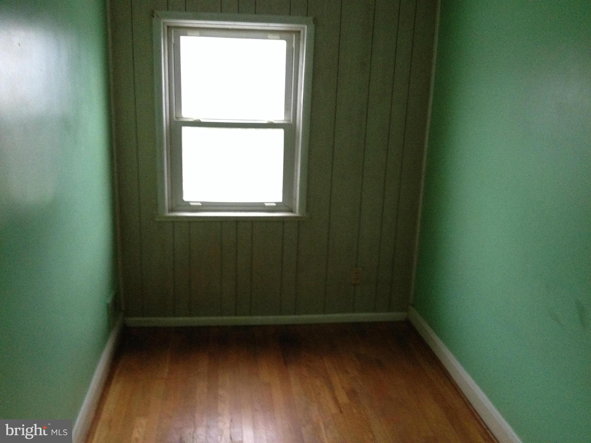 455 Torner Road Baltimore, MD 21221 - Photo 19 of 30 a view of a small space with wooden floor and a window