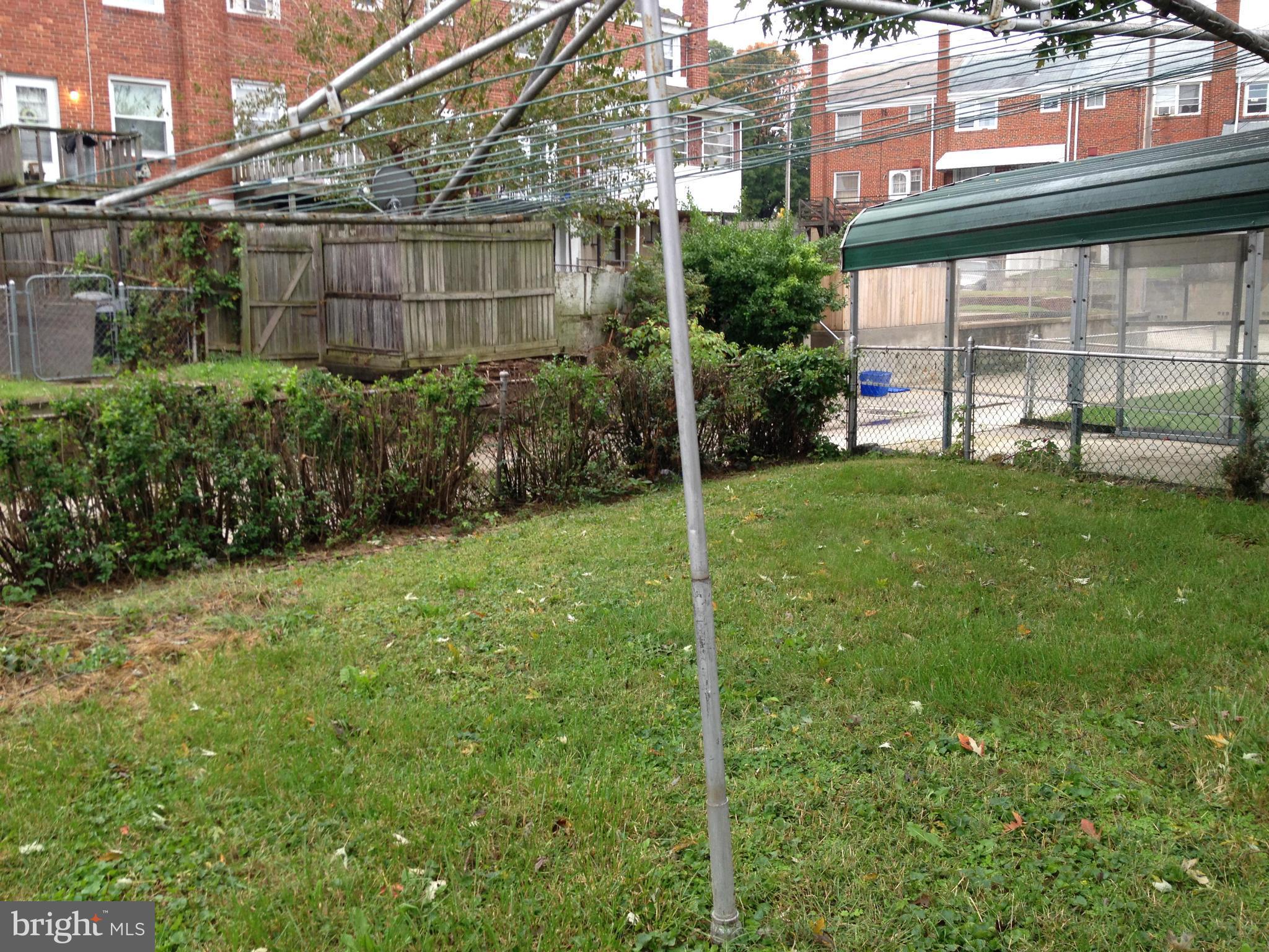 455 Torner Road Baltimore, MD 21221 - Photo 23 of 30 a view of a backyard with plants and large trees