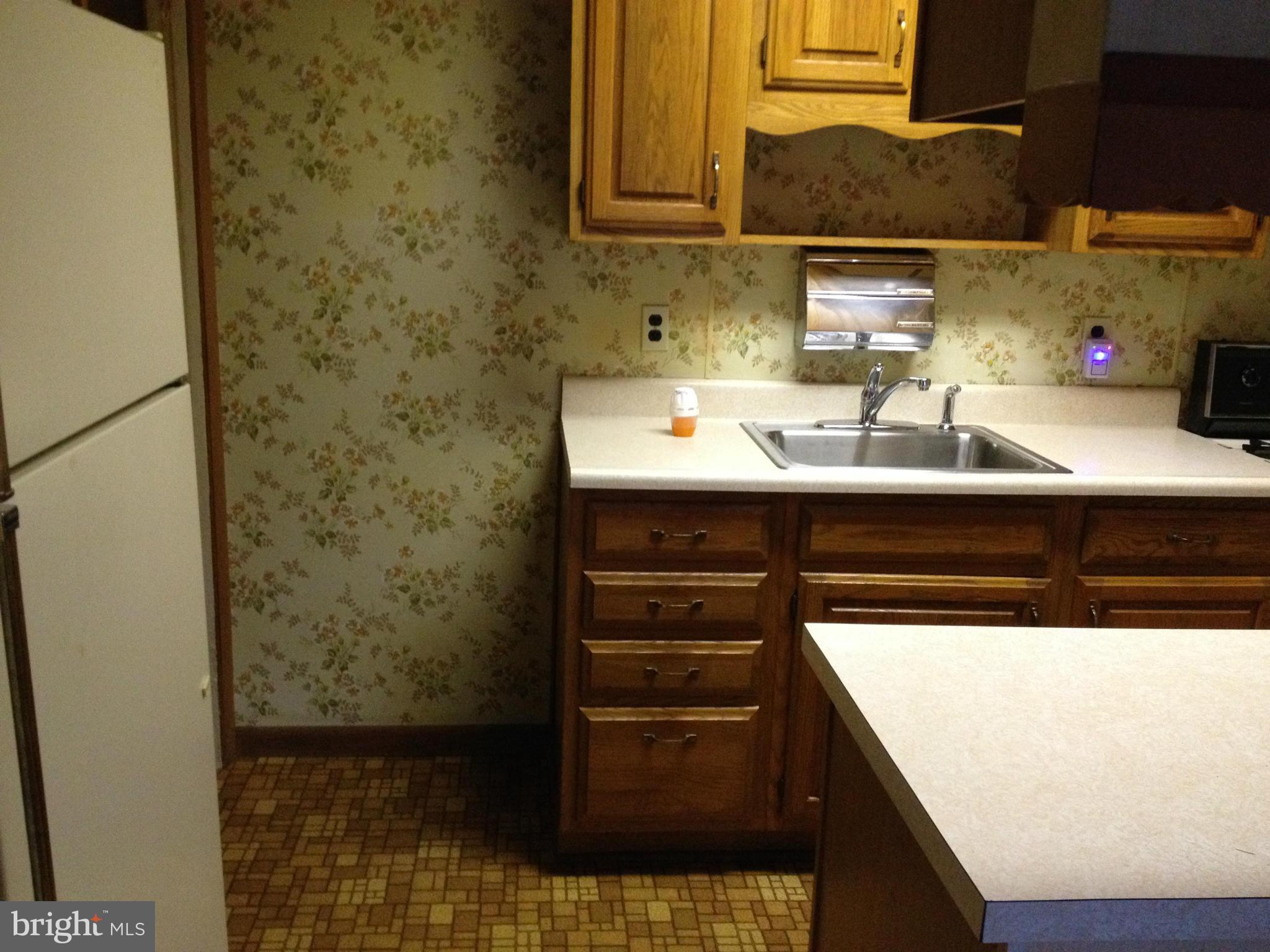 455 Torner Road Baltimore, MD 21221 - Photo 30 of 30 a bathroom with a sink and a mirror