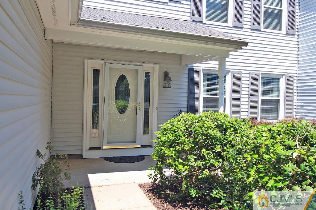 157 Woodbury Road Edison, NJ 08820 - Photo 3 of 25 a front view of a house with garden