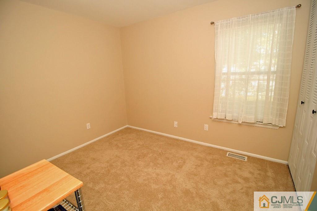 157 Woodbury Road Edison, NJ 08820 - Photo 22 of 25 a view of an empty room
