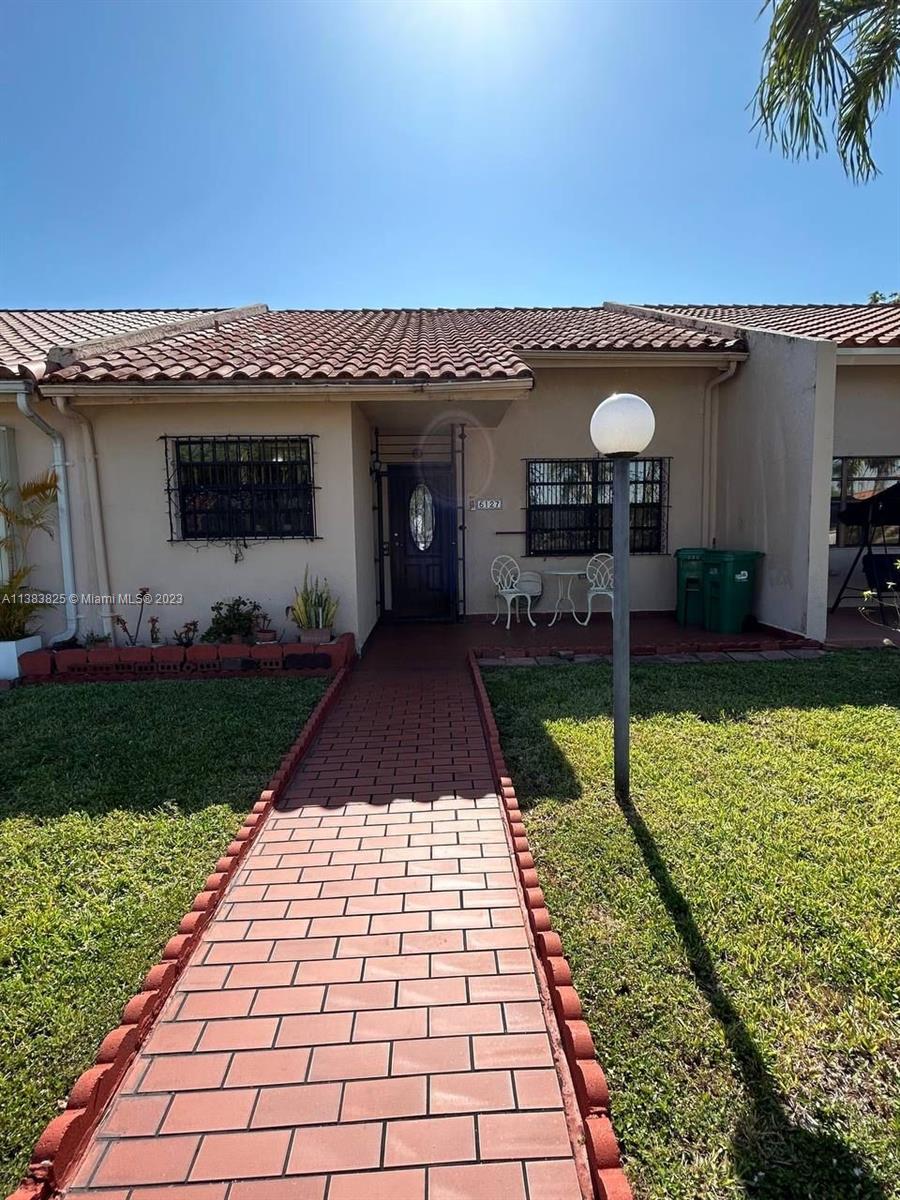 West End Miami, FL 33193 - Photo 1 of 5 a front view of a house with a yard