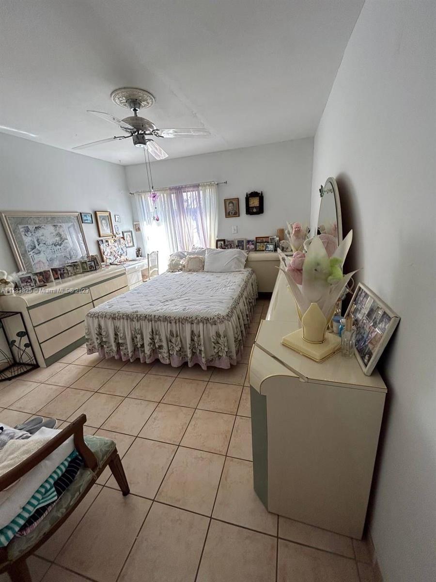 West End Miami, FL 33193 - Photo 4 of 5 a living room with furniture and a chandelier