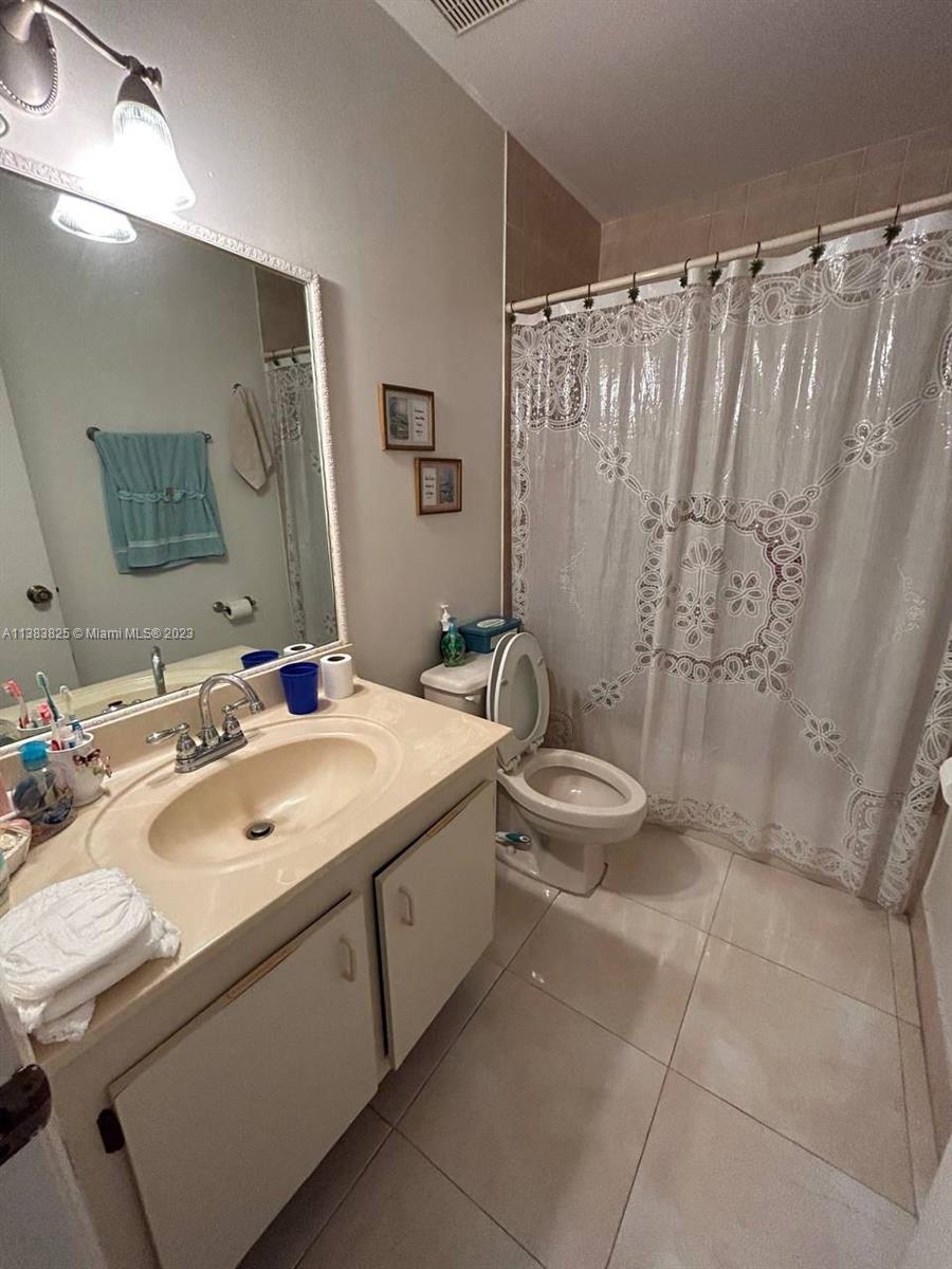 West End Miami, FL 33193 - Photo 5 of 5 a bathroom with a double vanity sink toilet and shower