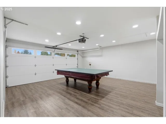 a room with wooden floor and furniture