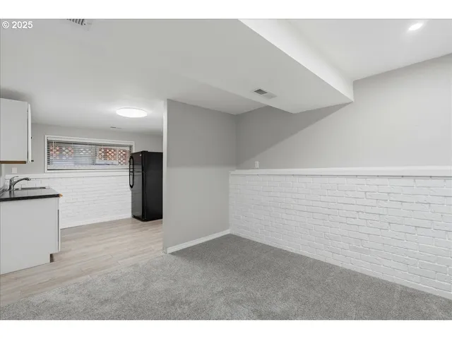 a view of a kitchen with a sink