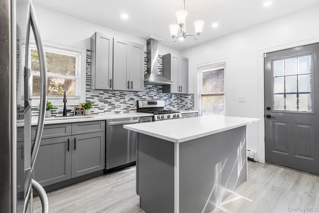 a kitchen with a sink cabinets and window