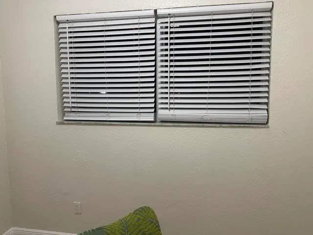 a view of a room that has a window in it