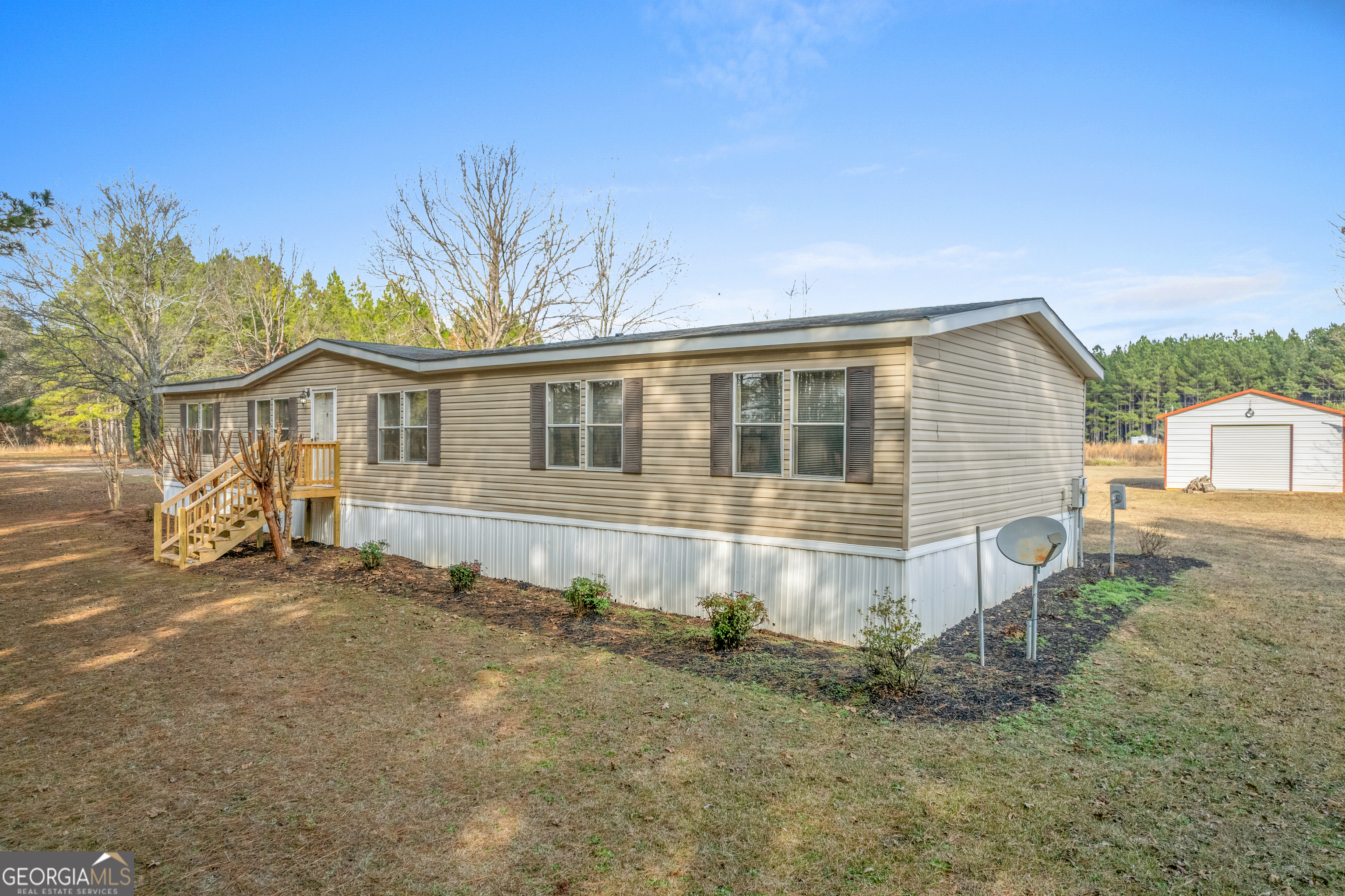 907 Sheppard Road Tennille, GA 31089 - Photo 2 of 54 a view of a house with a yard