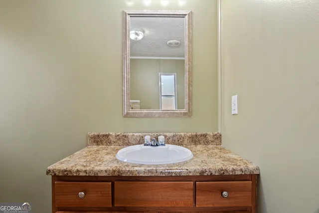 a bathroom with a toilet and a sink