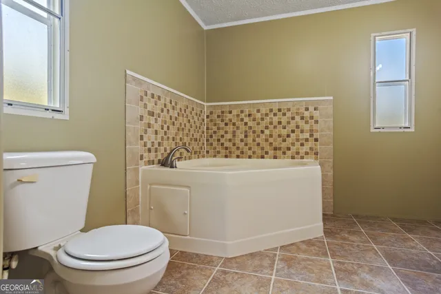 a bathroom with a bathtub and shower