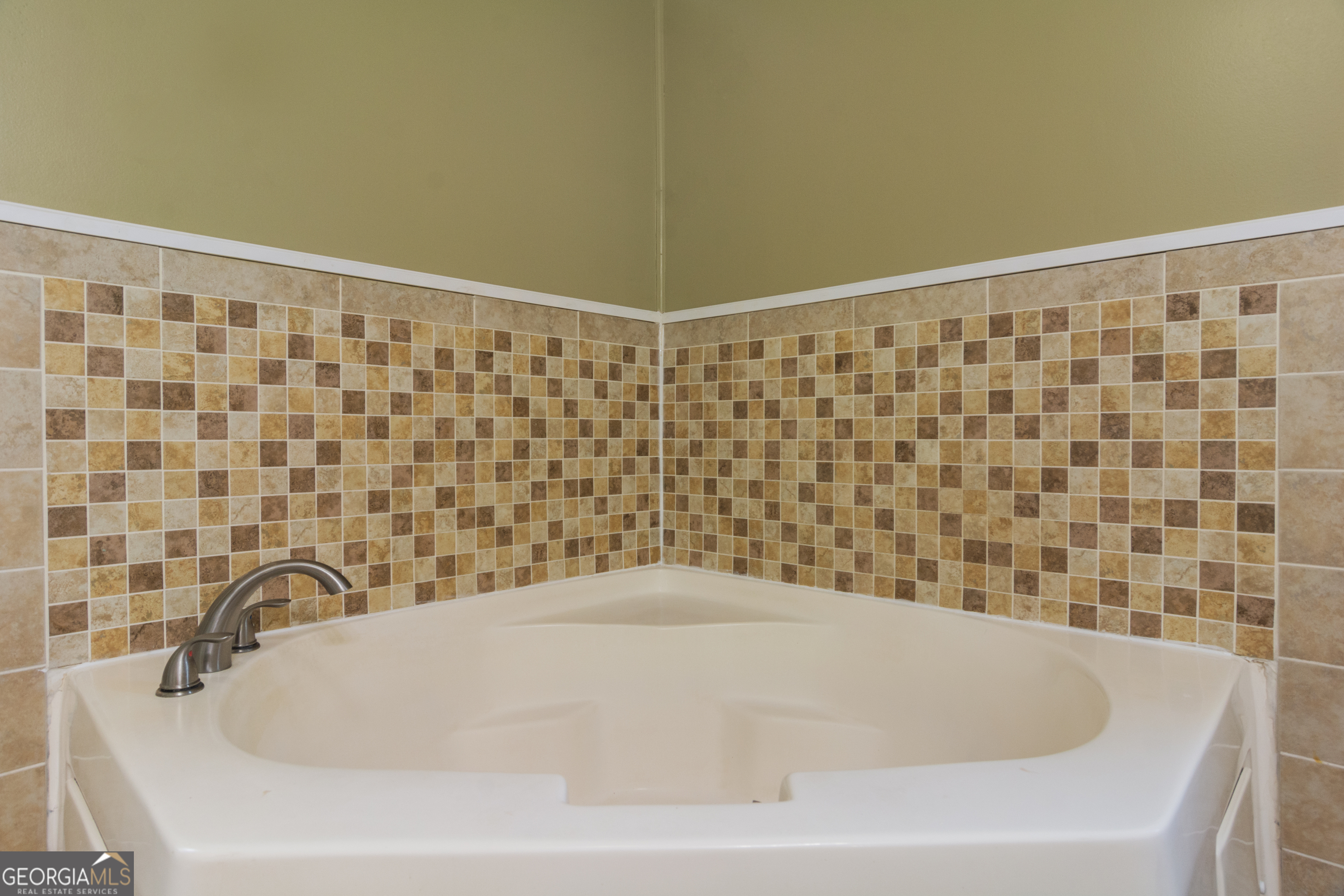 907 Sheppard Road Tennille, GA 31089 - Photo 27 of 54 a bathroom with a bathtub and shower