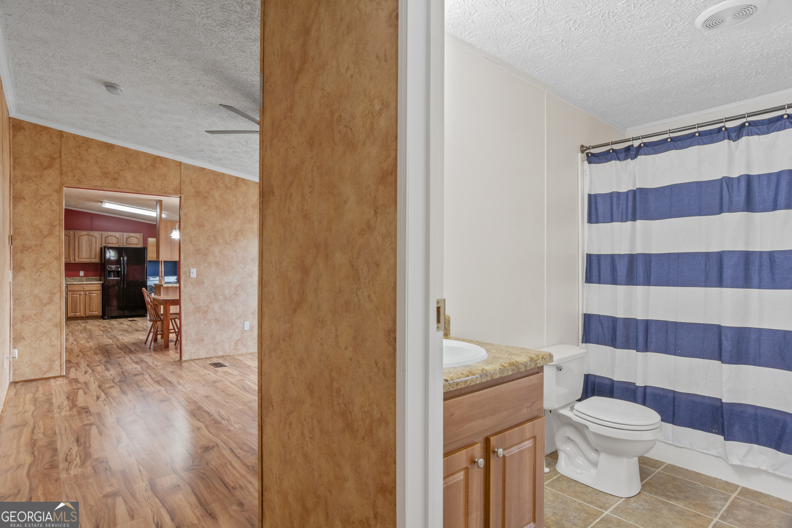907 Sheppard Road Tennille, GA 31089 - Photo 31 of 54 a bathroom with a toilet and a shower