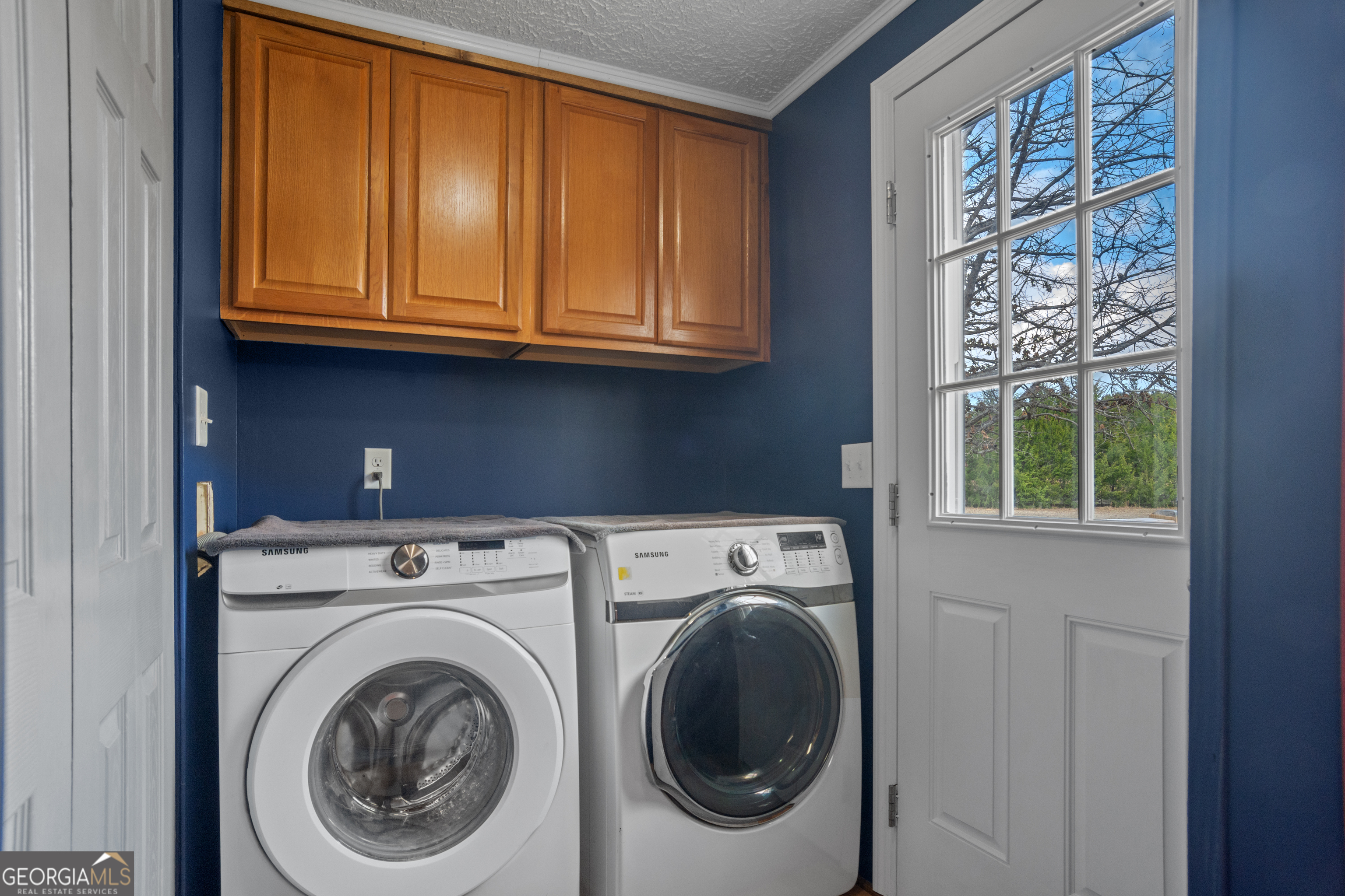 907 Sheppard Road Tennille, GA 31089 - Photo 44 of 54 a utility room with dryer and washer