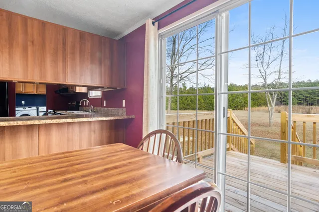 a view of a yard with iron fence