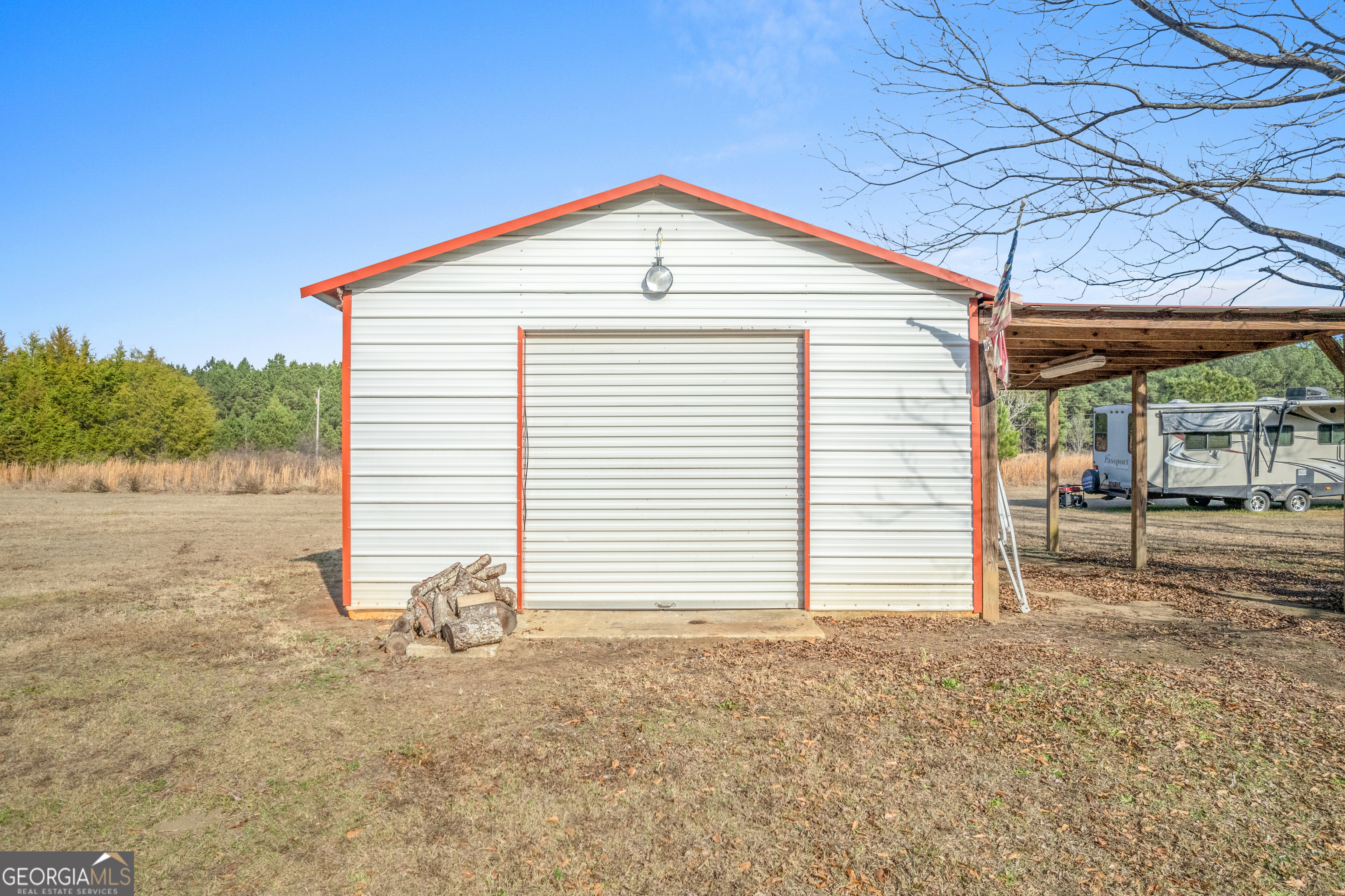 907 Sheppard Road Tennille, GA 31089 - Photo 46 of 54 a view of a house with a backyard