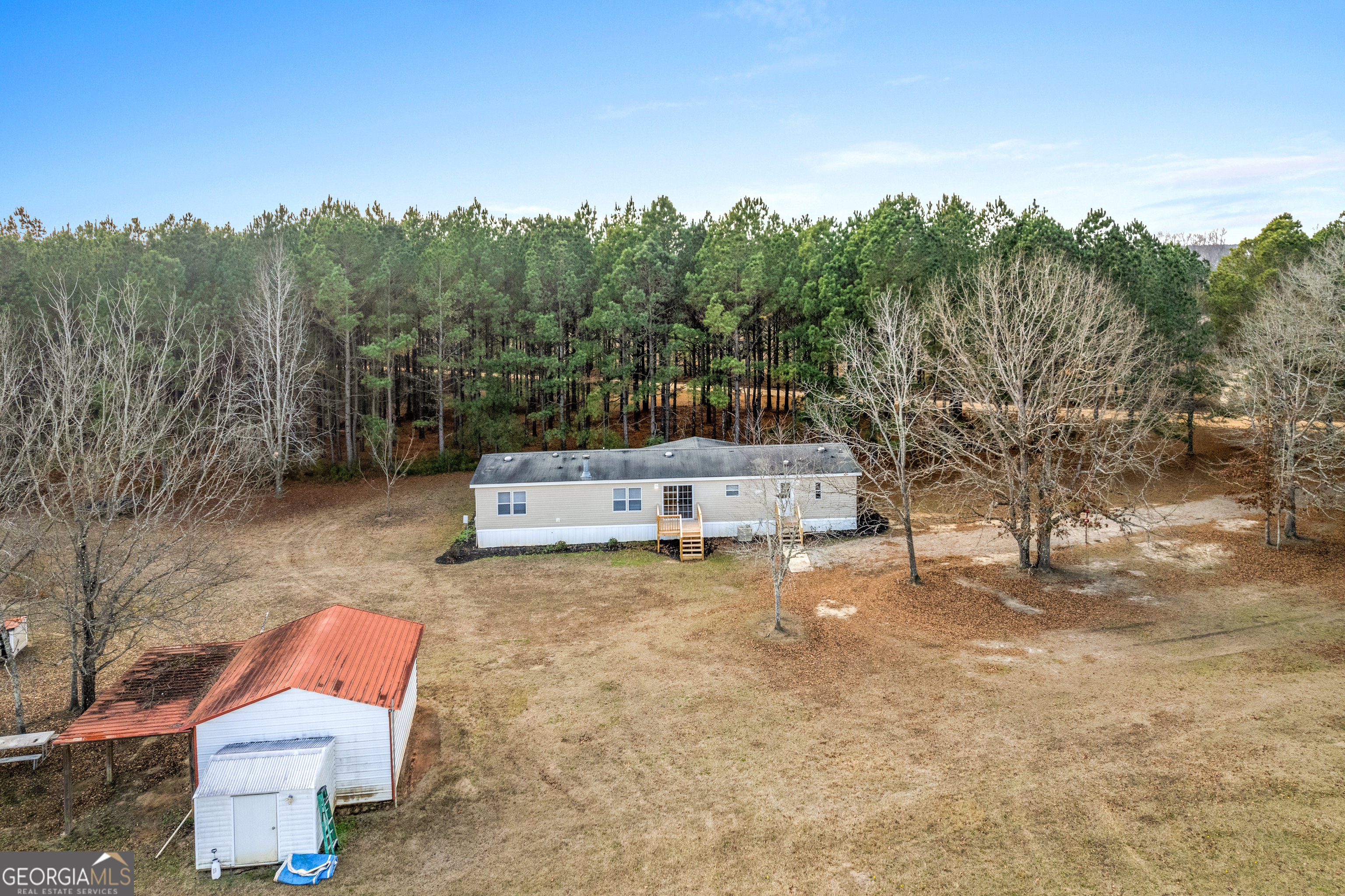 907 Sheppard Road Tennille, GA 31089 - Photo 48 of 54 a view of a yard with iron fence