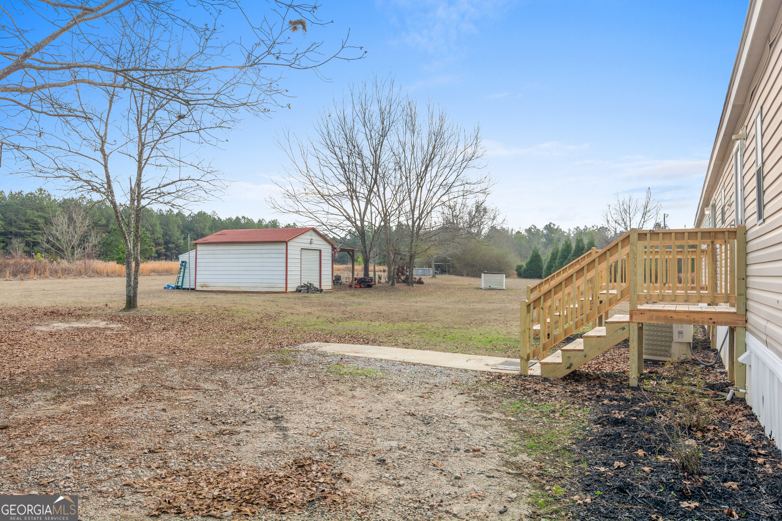 907 Sheppard Road Tennille, GA 31089 - Photo 53 of 54 a view of a house with a yard