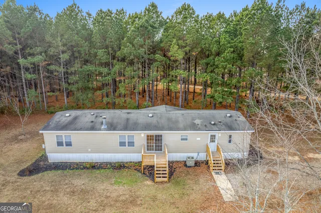 a view of a terrace with a bench and trees