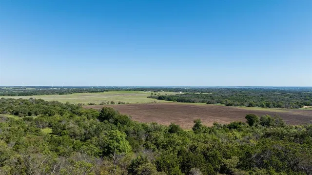 an aerial view of a houses with outdoor space