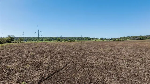a view of a lake with houses in the background
