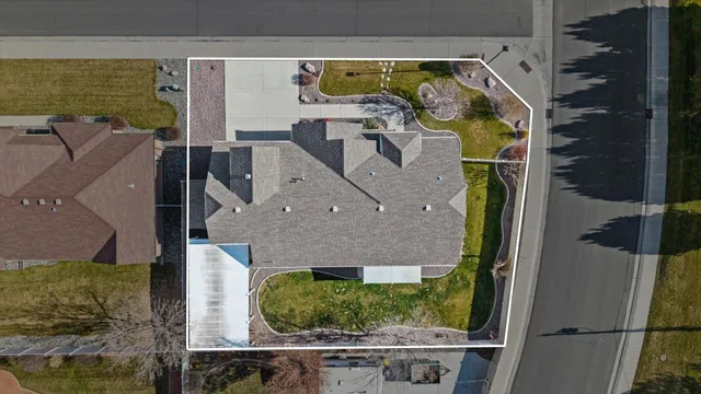 an aerial view of residential houses with outdoor space