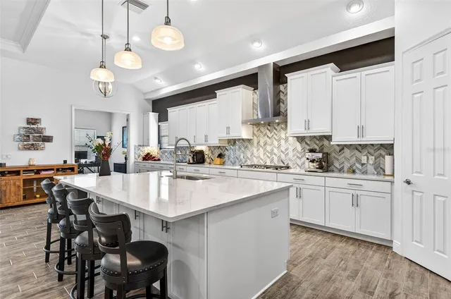 a spacious bedroom with a bed and a couch