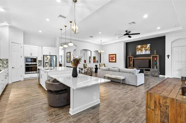 a spacious bathroom with a double vanity sink a mirror and a shower