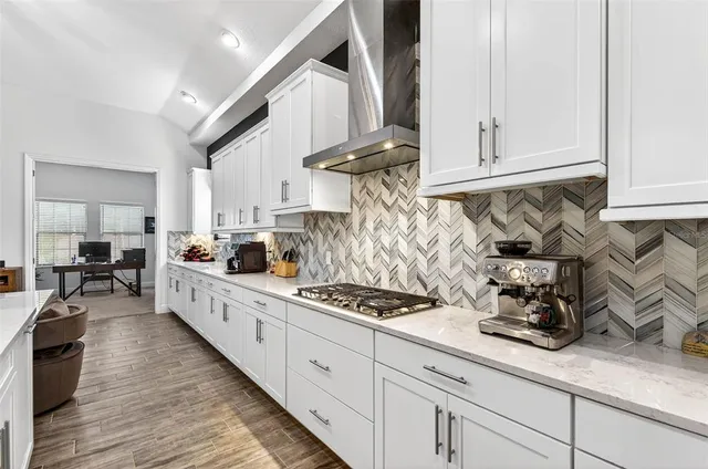 a bedroom with a bed and a night stand