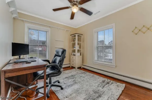 a workspace with furniture hardwood and a window
