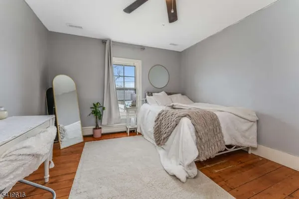 a bed room with a bed and a chair