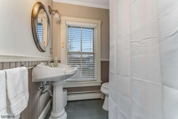 a bathroom with a sink a mirror and a bathtub