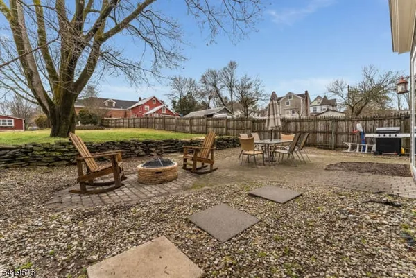 a view of a backyard with sitting area