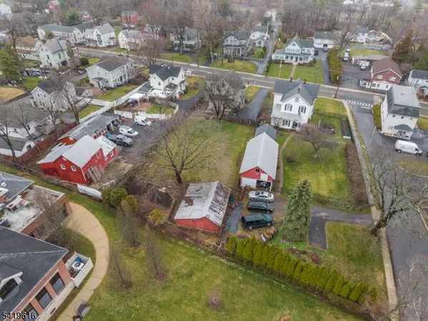 an aerial view of a house with a lake view