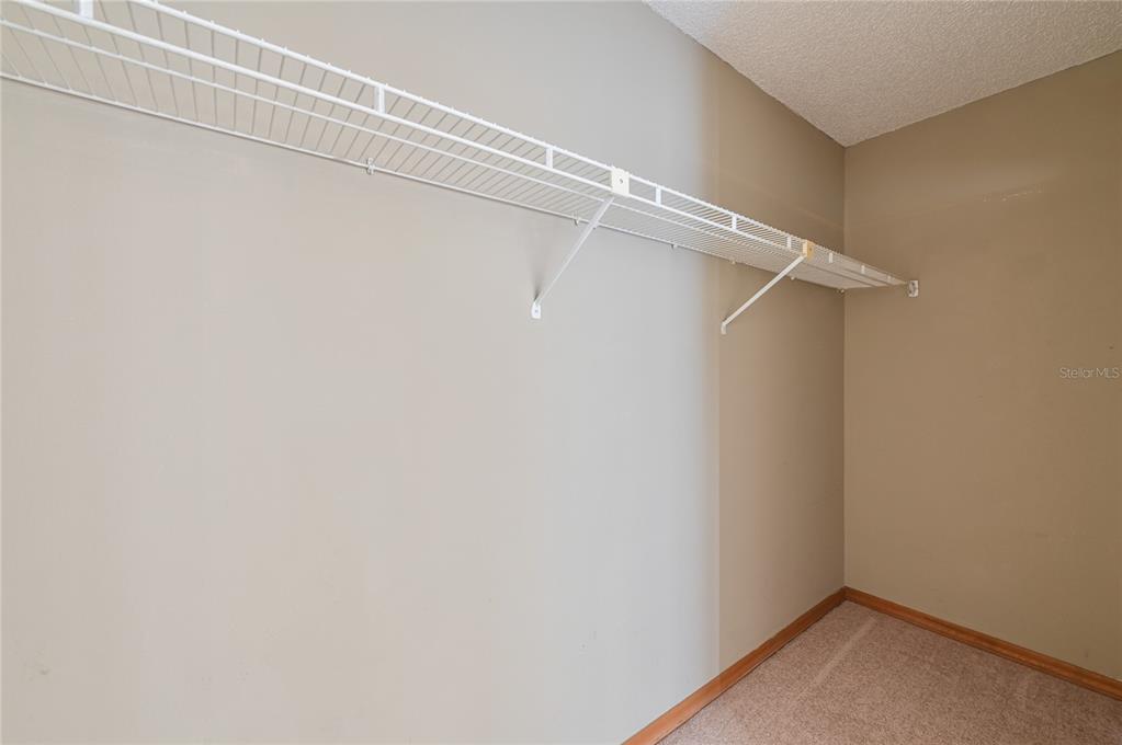 11001 Southeast Sunset Harbor Road, Unit H52 Summerfield, FL 34491 - Photo 13 of 31 a view of a room with racks on the wall