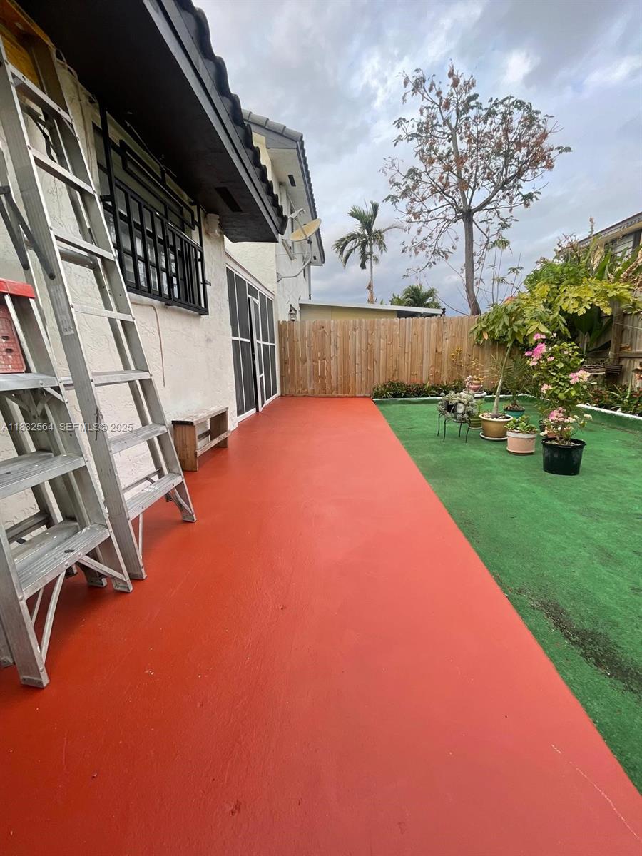 12057 Southwest 10th Street, Unit 202 Miami, FL 33184 - Photo 11 of 12 a view of backyard with trampoline