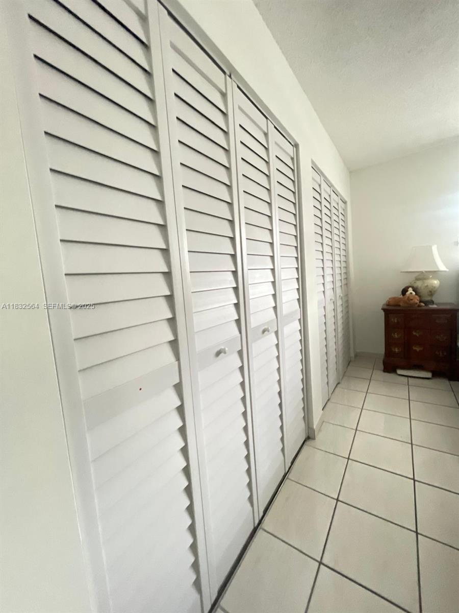 12057 Southwest 10th Street, Unit 202 Miami, FL 33184 - Photo 9 of 12 a view of a utility room and staircase