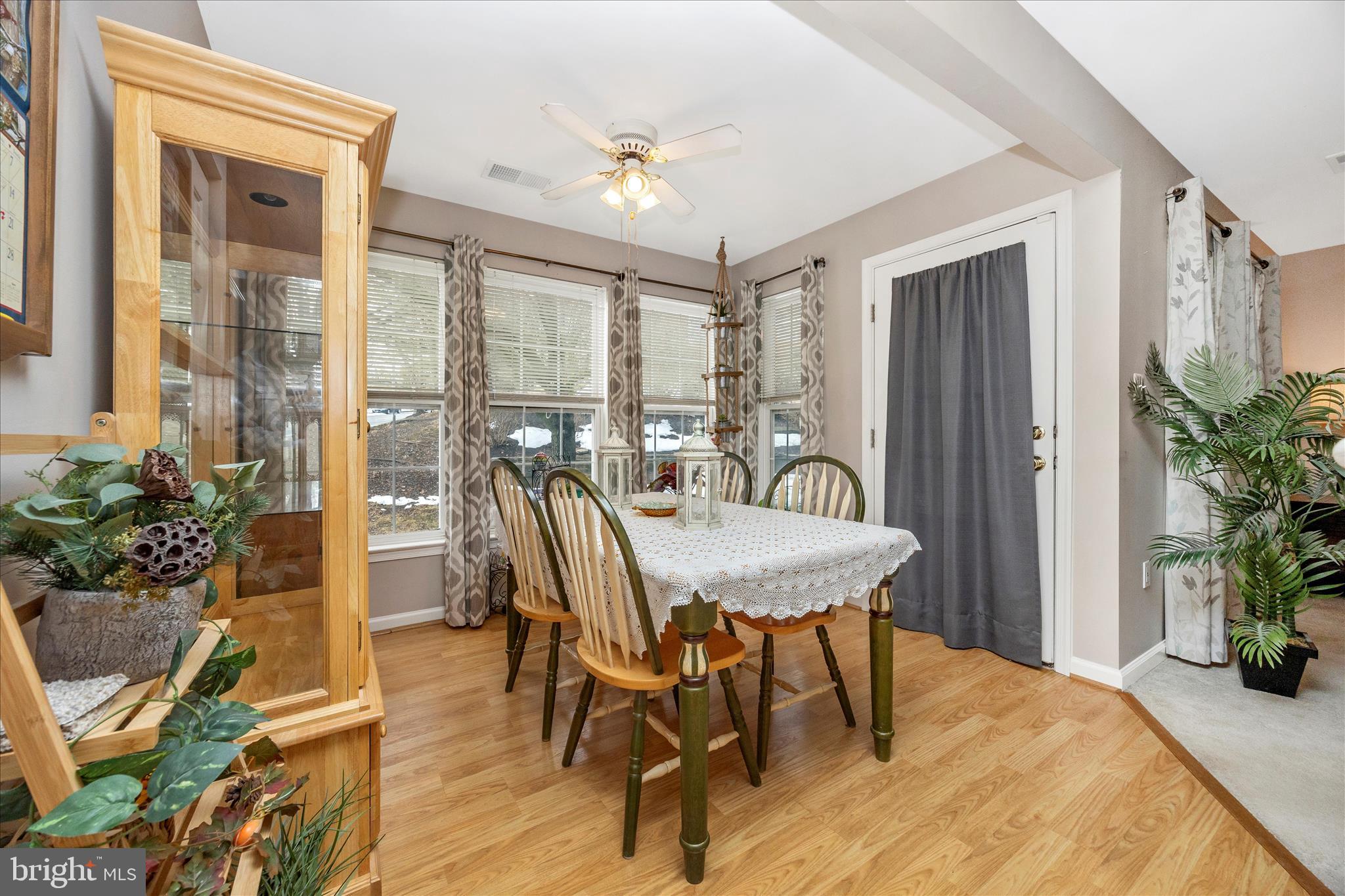 25900 Ridge Manor Drive, Unit 6000B Damascus, MD 20872 - Photo 11 of 39 a view of a dining room with furniture and wooden floor