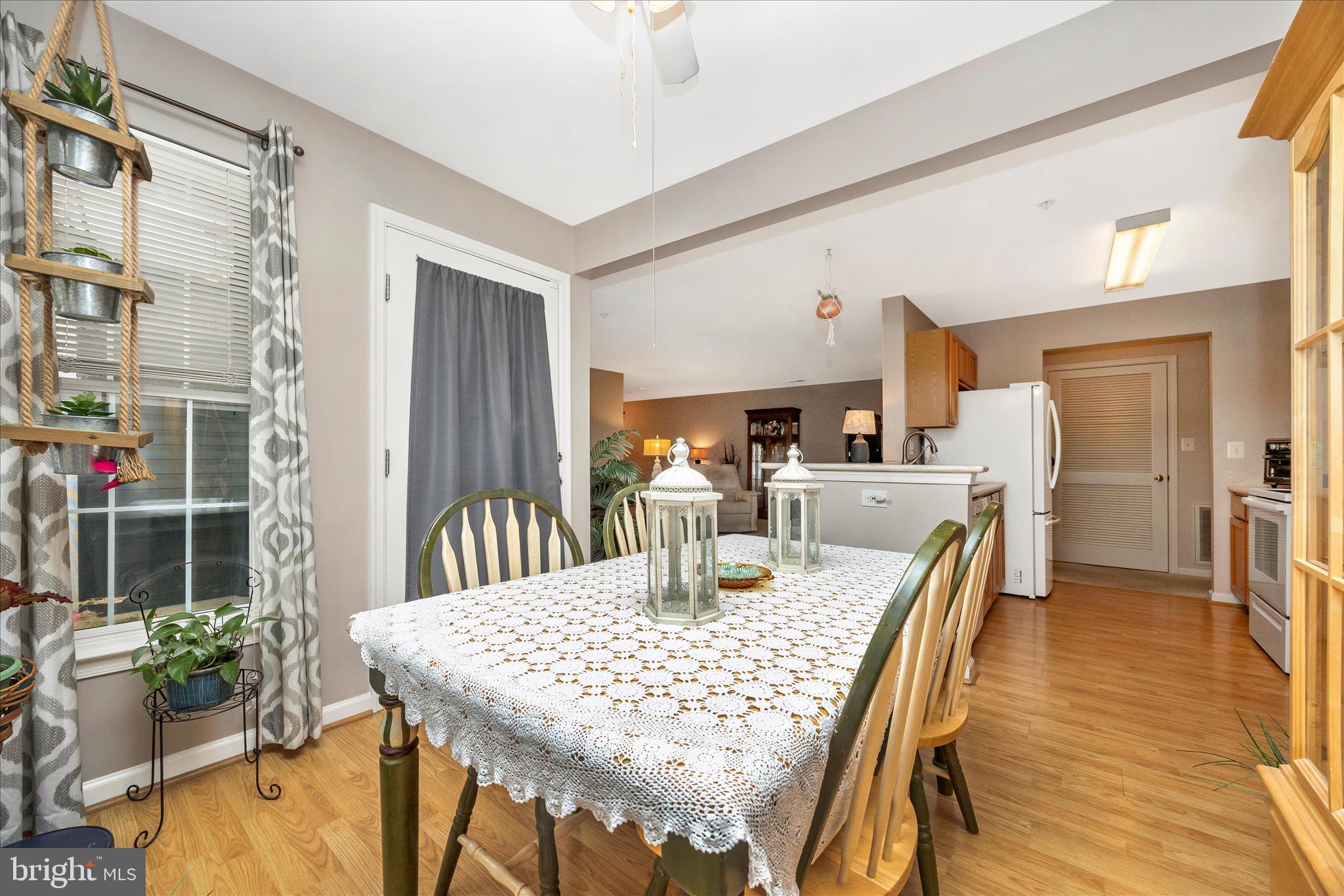 25900 Ridge Manor Drive, Unit 6000B Damascus, MD 20872 - Photo 12 of 39 a dining room with furniture and window