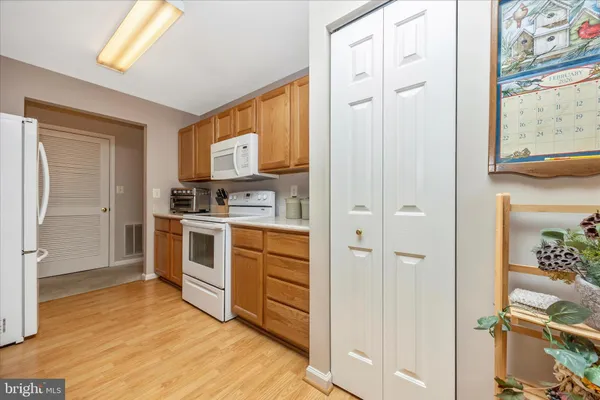 a kitchen with stainless steel appliances a refrigerator and a stove