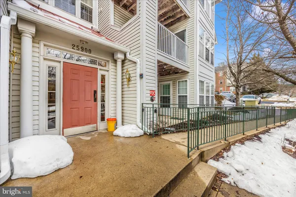a view of a brick house with large windows