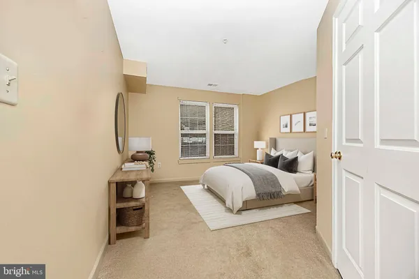 a bed room with a bed and a chair