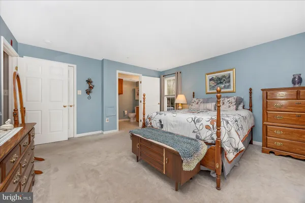 a bed room with a bed and a television